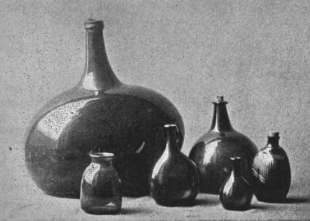 big bottle or flask with smaller ones