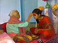 Image 6Senior offering Dashain Tika to junior (from Culture of Nepal)
