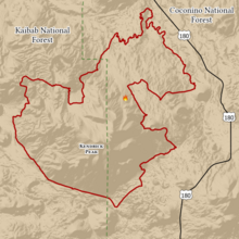 Jagged footprint of the fire is outlined in red, spanning parts of Kaibab and Coconino National Forests, west of U.S. Route 180