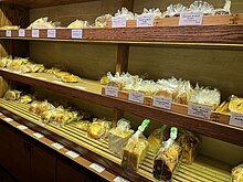 Photograph of shelves displaying various baked goods