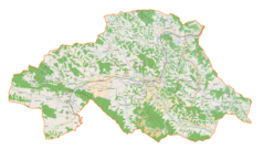 Mapa konturowa powiatu strzyżowskiego, w centrum znajduje się punkt z opisem „Skocznia narciarska w Strzyżowie”