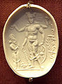 Vishnu Nicolo Seal representing Vishnu with a worshipper (probably Mihirakula), 4th–6th century CE. The inscription in cursive Bactrian reads: "Mihira, Vishnu and Shiva". British Museum.