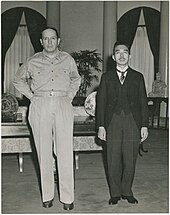 two men standing in a black and white portrait