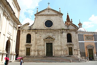 The facade of Santa Maria del Popolo, Rome, 1470s, with half-pediments at the mid-level by Bernini, replacing volutes