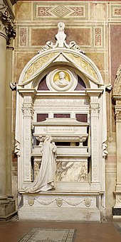 highly ornate white marble funerary monument