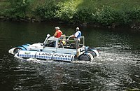 A Land Rover with inflatable floats to create a vehicle that will swim much like an improvised raft
