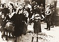 Warsaw Ghetto Uprising, April 1943: Jews being held at gunpoint by SS troops (from a report written by Jürgen Stroop for Heinrich Himmler)