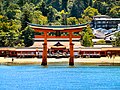 Itsukushima shrine taken from water with gate (tori) in foreground