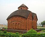 A brick temple with a domed roof