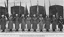 soldiers standing with flags