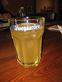 Hoegaarden Brewery wheat beer in its characteristic hexagonal glass