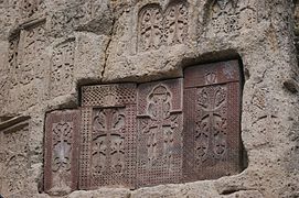 Khachkars (cross-stones) at Geghard Monastery painted with vordan karmir[29]