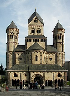 The westwork of the Maria Laach Abbey, Germany, 12th century, (porch 1225) is typical of Germany, a form that dates to Carolingian architecture with grouped towers of different plans and both "candle-snuffer" and Rhenish helm spires.