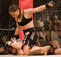 Image 4Gina Carano applying a ground-and-pound on her opponent. (from Mixed martial arts)