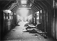 Around eight bodies are lying around a hallway after the Viipuri county jail massacre, an example of Red Terror. Thirty White prisoners were killed by the Reds.