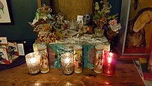 Photograph of a collection of candles and other interior restaurant decor