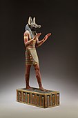 Anubisen estatua; K.a. 332–30 igeltsu eta margotutako egurra; 42,3 cm; Metropolitan Museum of Art