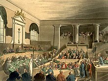 a painting of a large, pillared white room filled with people in the middle of a court case. The view is from the side; an advocate can be seen in a box on the right, while on the left are a panel of judges sitting in front of a curved desk.