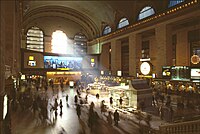 A 1986 image of the Main Concourse with large and bright advertisements throughout