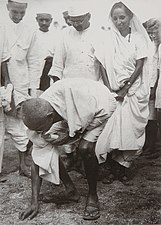 Mahatma Gandhi picking salt at Dandi beach, South Gujarat, ending the Salt satyagraha on 5 April 1930