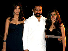 Haasan in white, next to daughters Shruti and Akshara, dressed in black