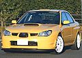 Subaru Impreza WRX STI spec C Type RA-R, a high-performance variant of the standard Subaru Impreza sedan. This photo shows the front of the car, which is yellow with white wheels.