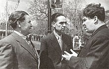 A black-and-white photograph of Soviet writers Fatix Xösni, Äxmät İsxaq, Mustai Karim circa 1960.