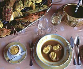 A traditional bouillabaisse from Marseille, soup and fish served separately