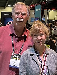 Roberta Williams and her husband Ken in a convention center