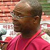 Headshot of Mike Singletary in front of a microphone