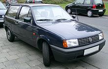 Front-three quarter view of a small three-door car with flush headlamps.