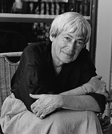 Black-and-white image of Le Guin seated facing the camera