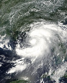 Tropical Storm Barry viewed from Space on August 5, 2001. The storm is approaching the Florida Panhandle. At the bottom of the image is the Yucatan Peninsula, while Cuba is seen on the right. The image is focused on the Gulf of Mexico.