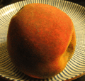 Decomposition:a decaying peach over a period of six days. Each frame is approximately 12 hours apart, as the fruit shrivels and becomes covered with mold.