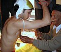 Image 8Upanayana samskara ceremony in progress. Typically, this ritual was for eight-year-olds in ancient India, but in the 1st millennium CE it became open to all ages. (from Samskara (rite of passage))
