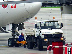 A Unimog being used as a pushback tractor