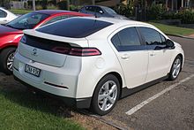 Slightly sloped three-quarters front view image of a white liftback with Holden badging and short suspension.