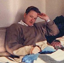 An old photo of Conan O'Brien sitting on a couch