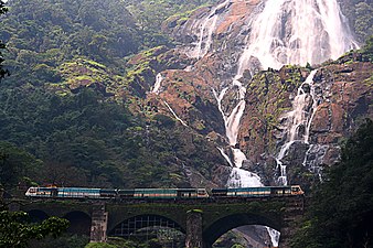 Train passing next to the Dudhsagar Falls
