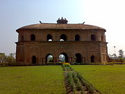 Rang Ghar, built by Pramatta Singha in Ahom kingdom's capital Rangpur, is one of the earliest pavilions of outdoor stadia in the Indian subcontinent.
