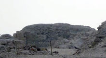 Low ruins of a pyramid in the desert