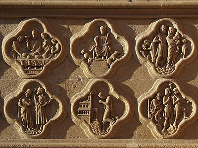Ces bas-reliefs du soubassement du portail de droite (de la Mère-Dieu) de la façade occidentale se trouvent sous les statues des rois Salomon et Hérode et datent du début du XIIIe siècle[26].