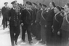 In this photograph, King George VI is inspecting the crew of the Norwegian ship HNoMS Draug, which was docked in Portsmouth sometime during the war.