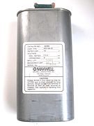 This high-energy capacitor from a defibrillator has a resistor connected between the terminals for safety, to dissipate stored energy.