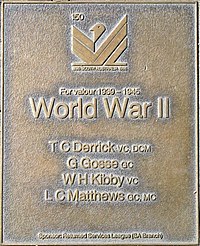 an image of a bronze plaque listing highly decorated service personnel of World War II