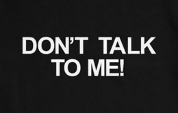 The words "don't talk to me!" in capitalized white text on a black background