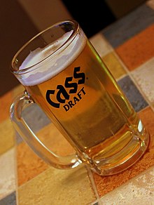 Cass beer in a beer mug