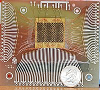 Magnetic-core memory, 18×24 bits, with a US quarter for scale
