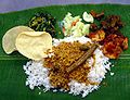 Image 141A typical serving of banana leaf rice. (from Malaysian cuisine)