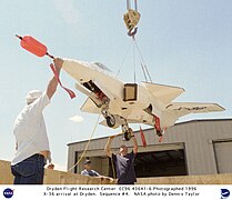 The aircraft is hoisted following its arrival at NASA Dryden Flight Research Center in July 1996